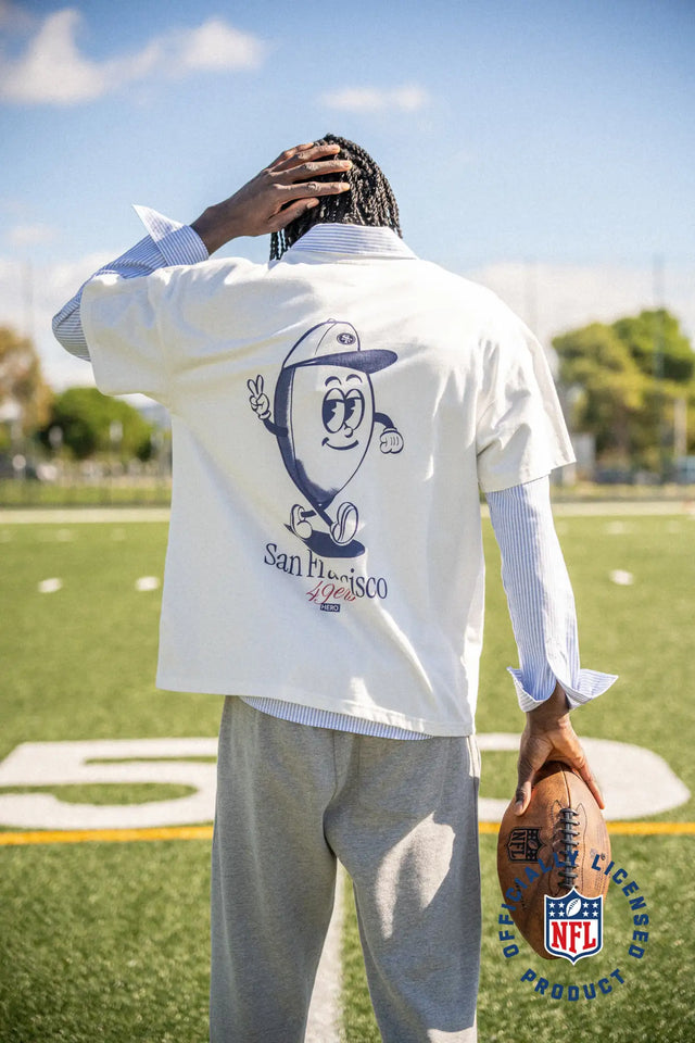 Veste de baseball blanche avec design de personnage de dessin animé et texte « san francisco ».